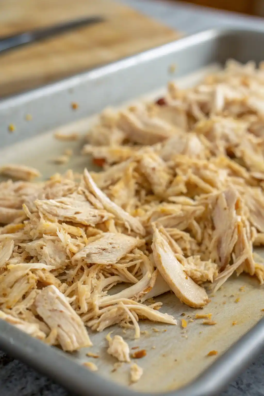 Crispy shredded chicken on a baking sheet